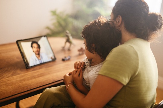 mother-and-child-video-calling-their-family-doctor-at-home 540x360